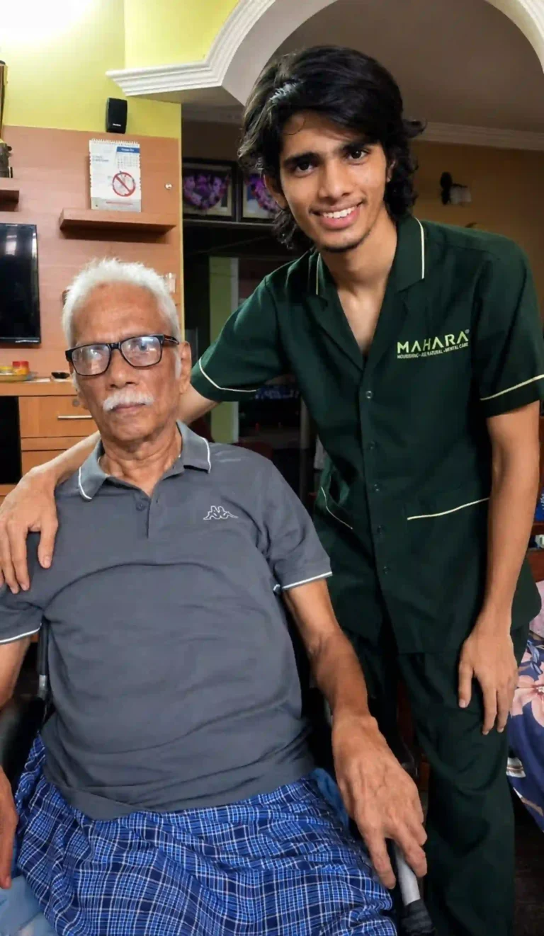 Caregiver supporting elderly man at home