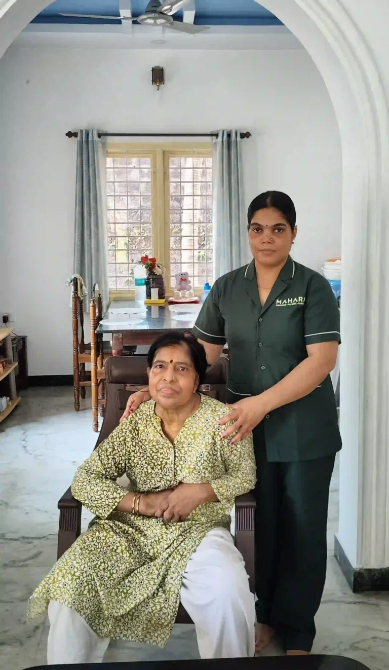 Caregiver supporting elderly woman at home