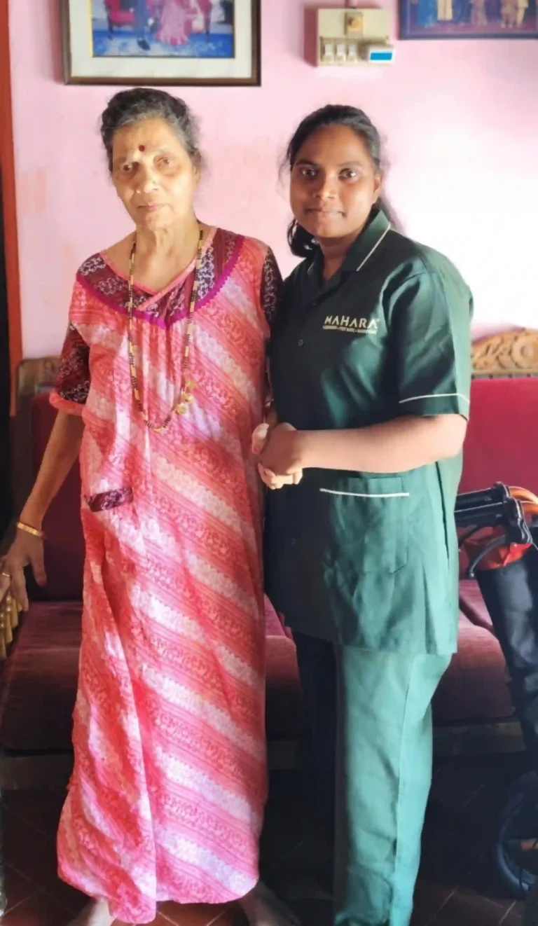 Mahara home nurse holding hands with an elderly woman